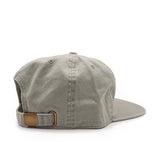 Gray cap with a brown strap on a white background