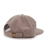 Brown ribbed cap with a brown leather patch on a white background