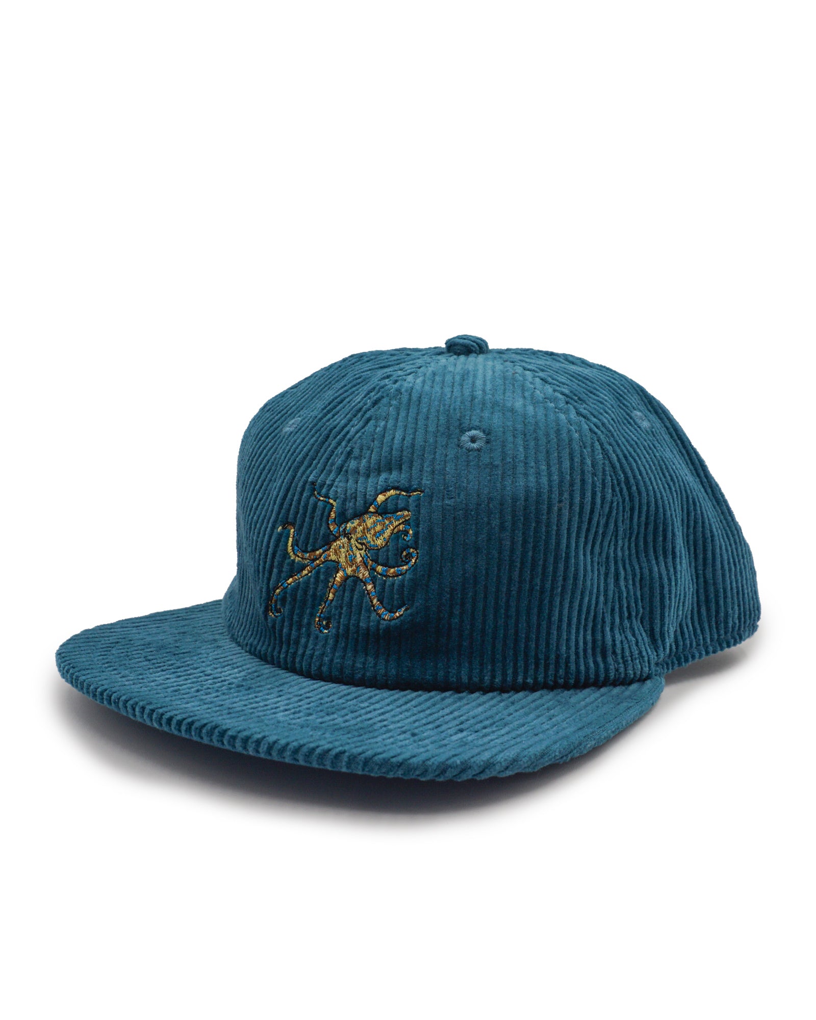 Blue corduroy cap with a blue ringed octopus design on a white background