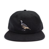 Black cap with a California Quail design on a white background