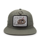 Green cap with a Gaboon Viper patch on a white background