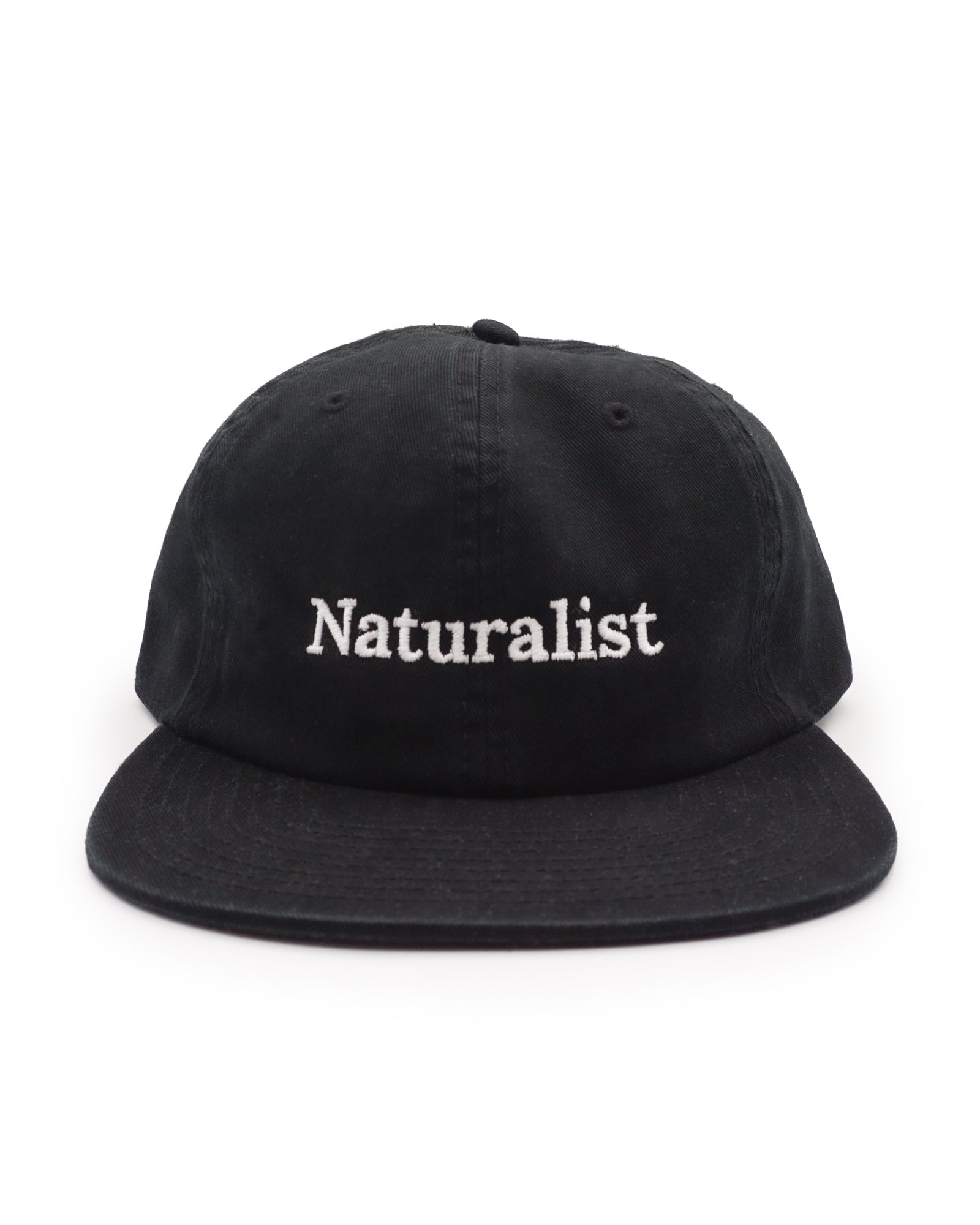 Black cap with 'Naturalist' text on a white background