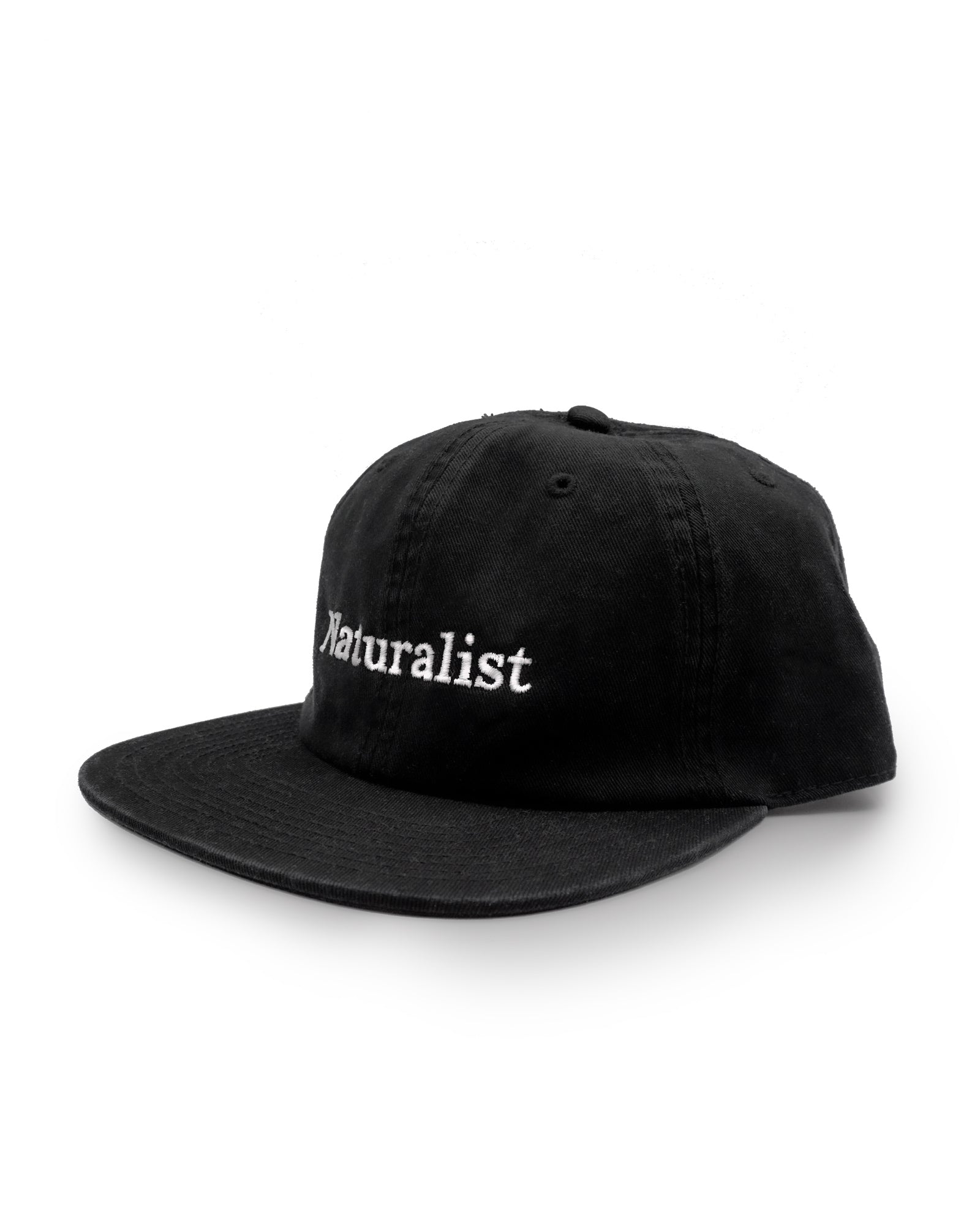 Black cap with 'Naturalist' text on a white background