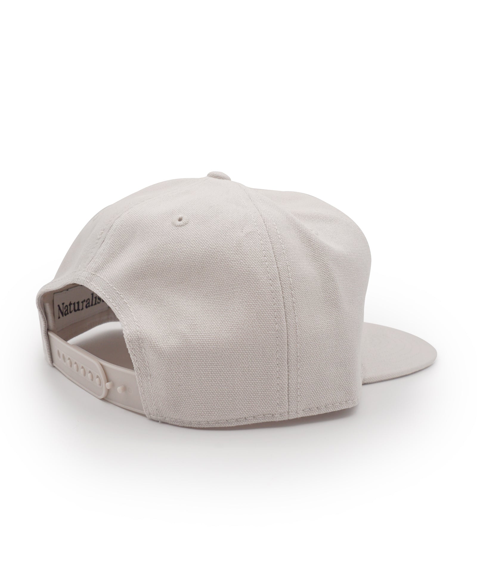 Bone colored cap on a white background
