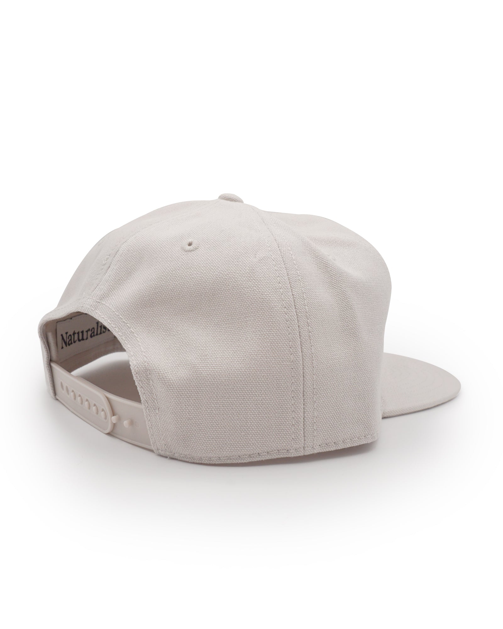 Bone colored cap on a white background