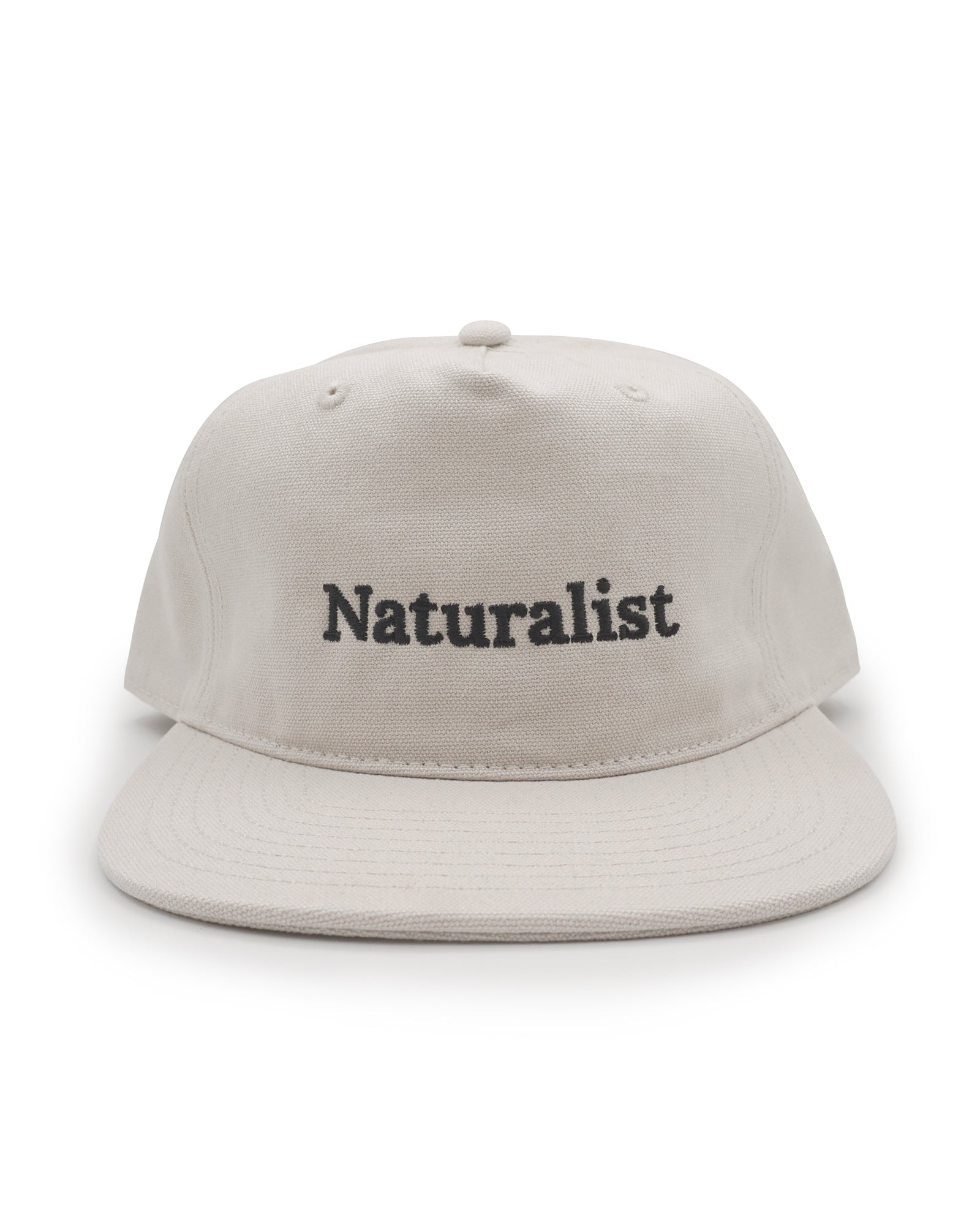 Bone colored cap with 'Naturalist' text on a white background