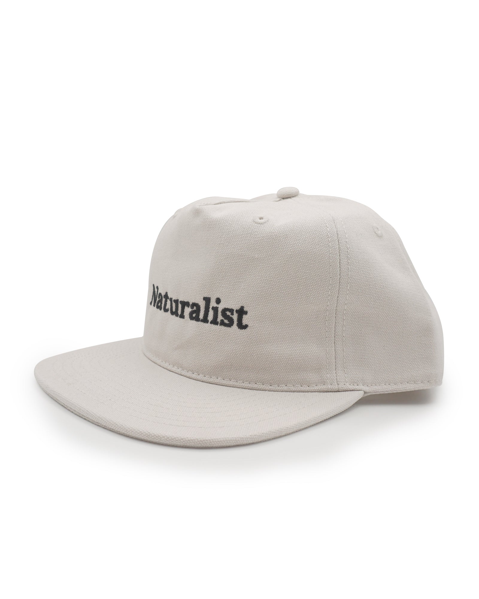 Bone colored cap with 'Naturalist' text on a white background