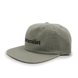 Leaf green cap with 'Naturalist' text on a white background