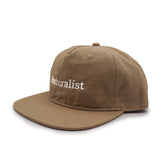 Sand brown cap with 'Naturalist' embroidery on a white background