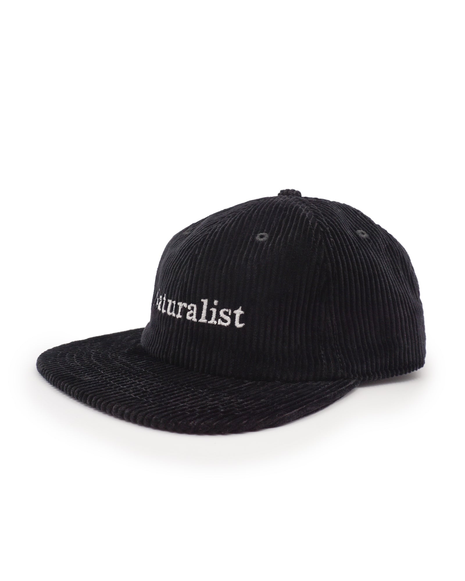 Black corduroy cap with 'naturalist' embroidery on a white background