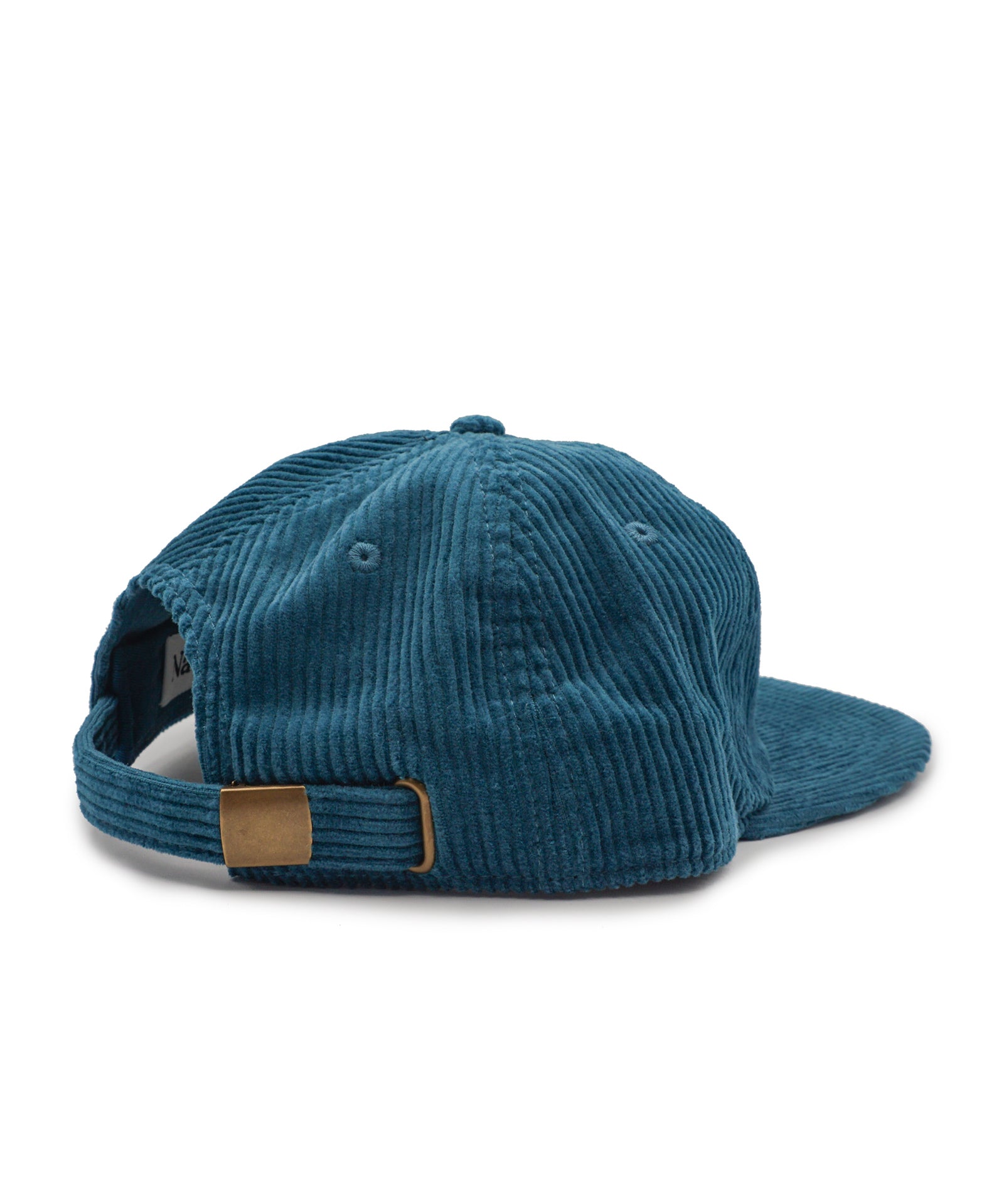 Teal corduroy cap with a brown patch on a white background