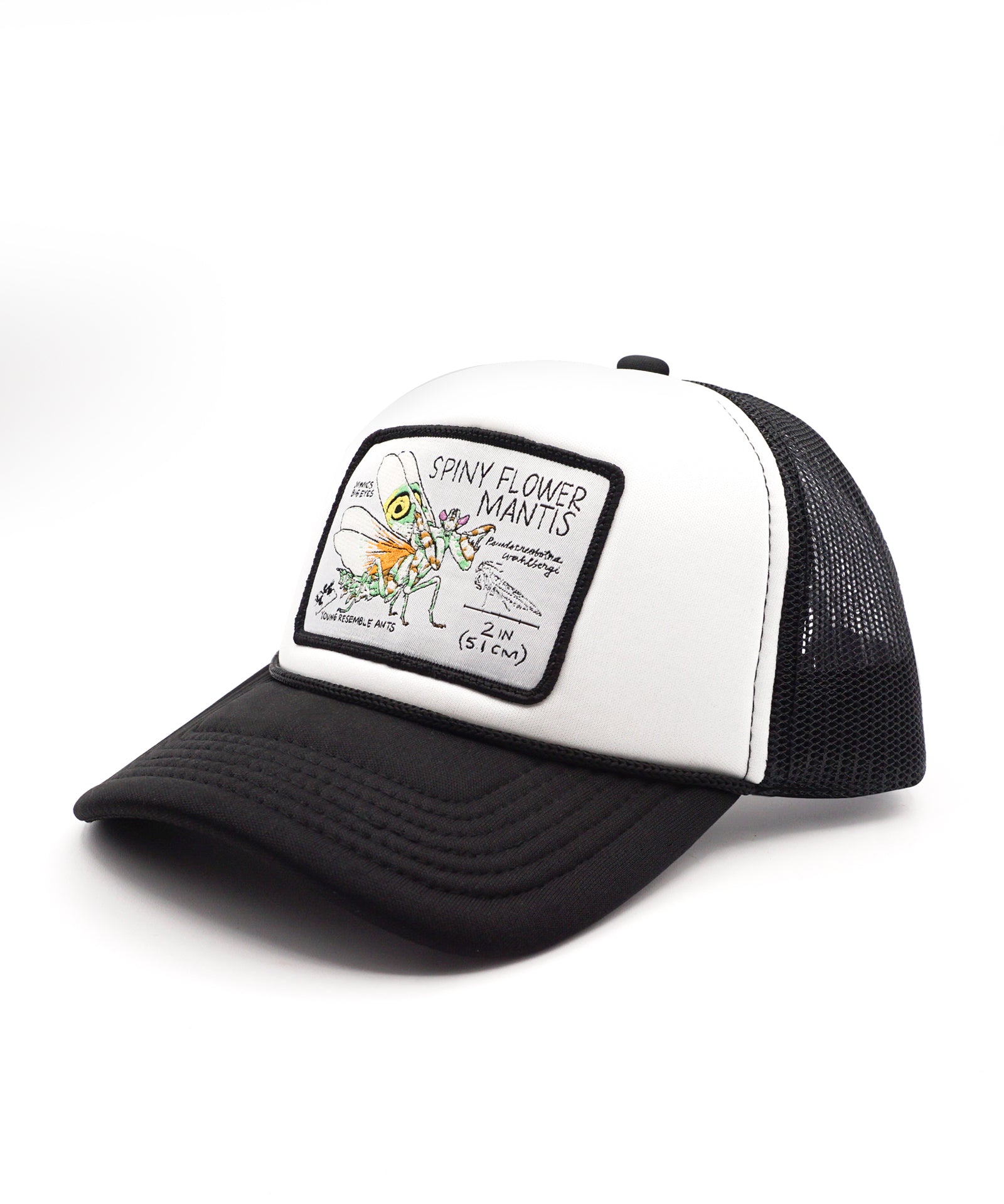 Black and white youth trucker hat with a spiny flower mantis patch on a white background