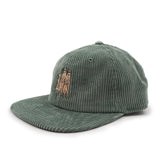 Green corduroy cap with embroidered meerkat design on a white background