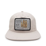 Beige cap with a patch featuring illustrations of meerkats on a white background