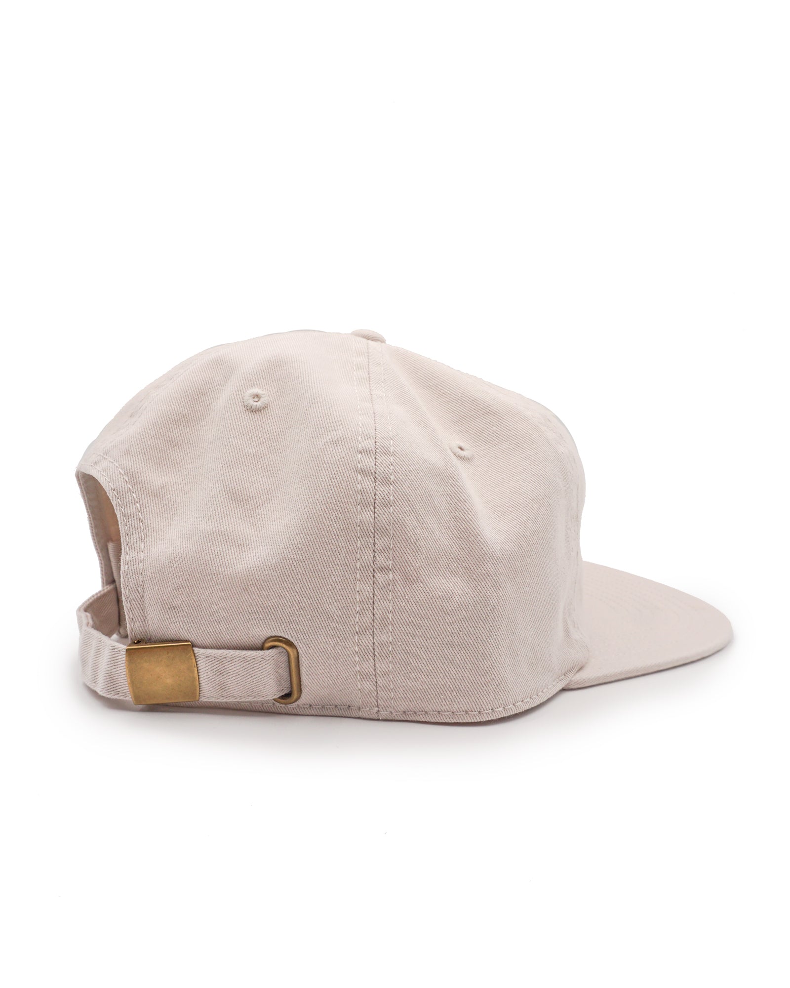 Beige cap with a brown leather strap on a white background