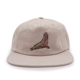 Beige cap with an elephant seal embroidered on a white background
