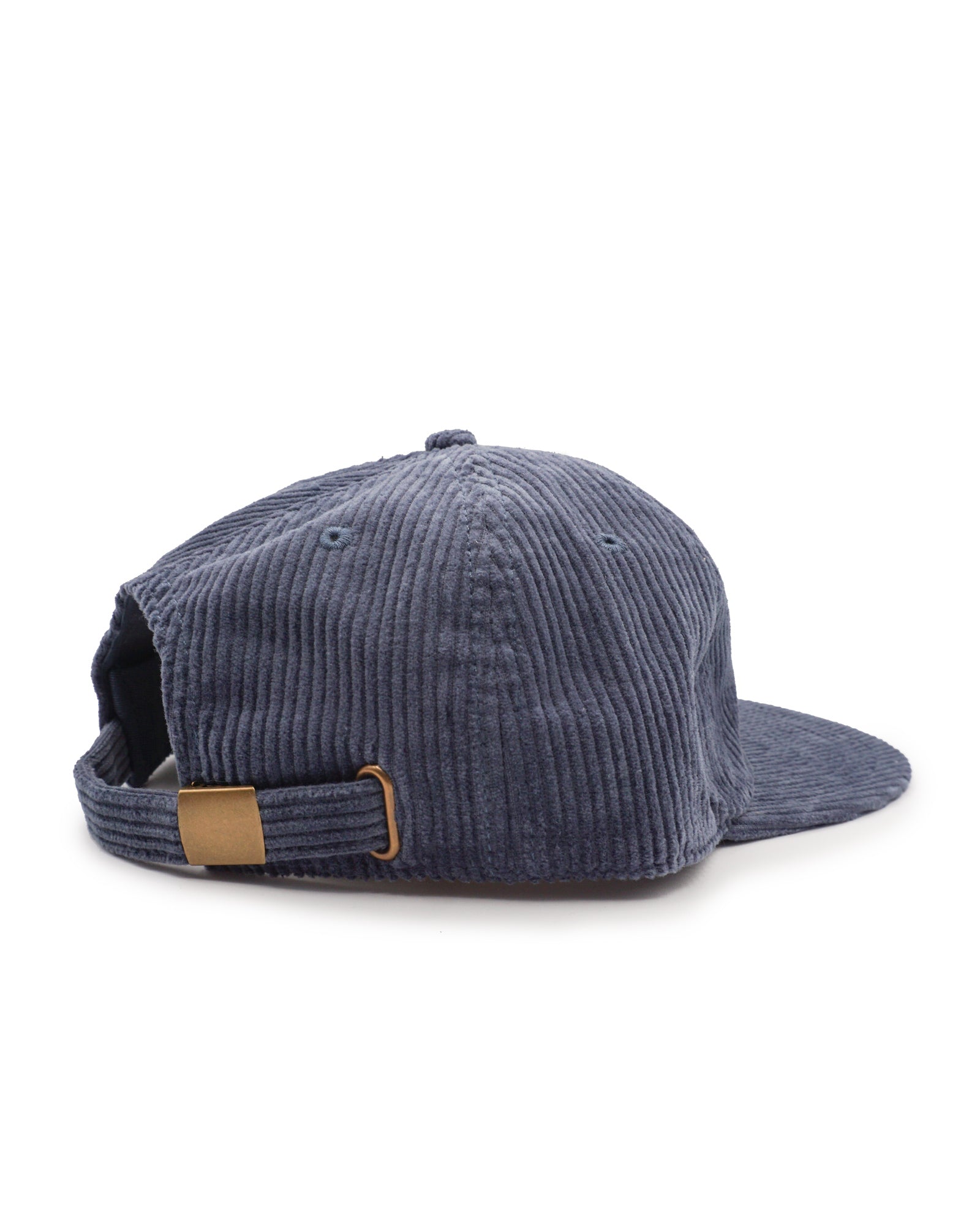 Blue corduroy cap with a brown patch on a white background