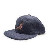 Navy blue corduroy cap with an elephant seal on a white background