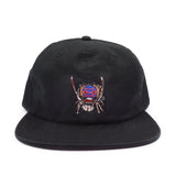 Black cap with a peacock spider design on a white background