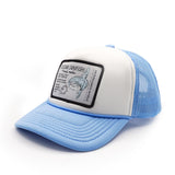 Blue and white youth trucker hat with a ocean sunfish patch on a white background
