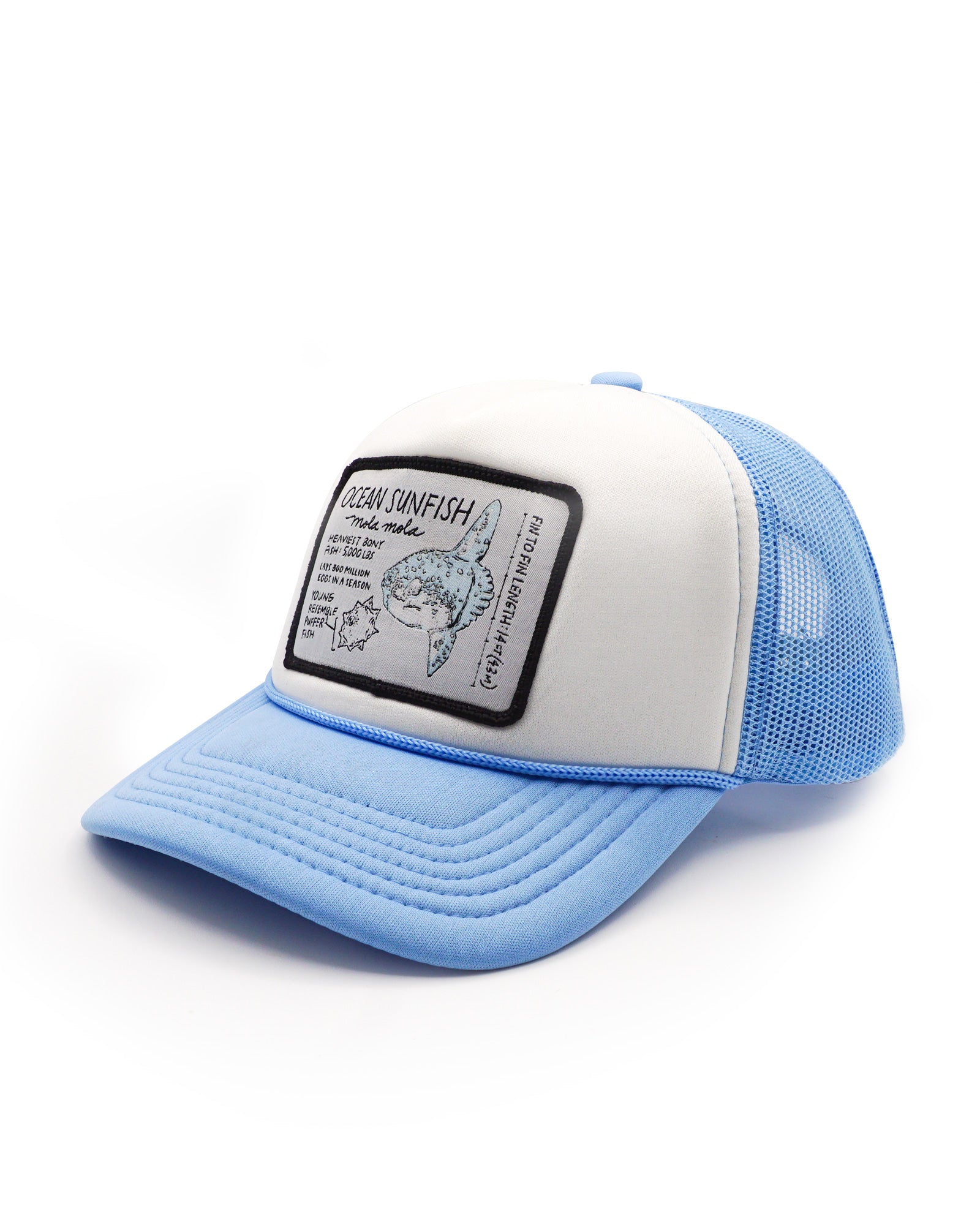 Blue and white youth trucker hat with a ocean sunfish patch on a white background