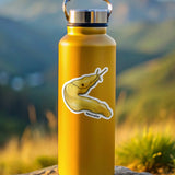 Yellow water bottle with a sticker of a banana slug on a rock with a mountainous background