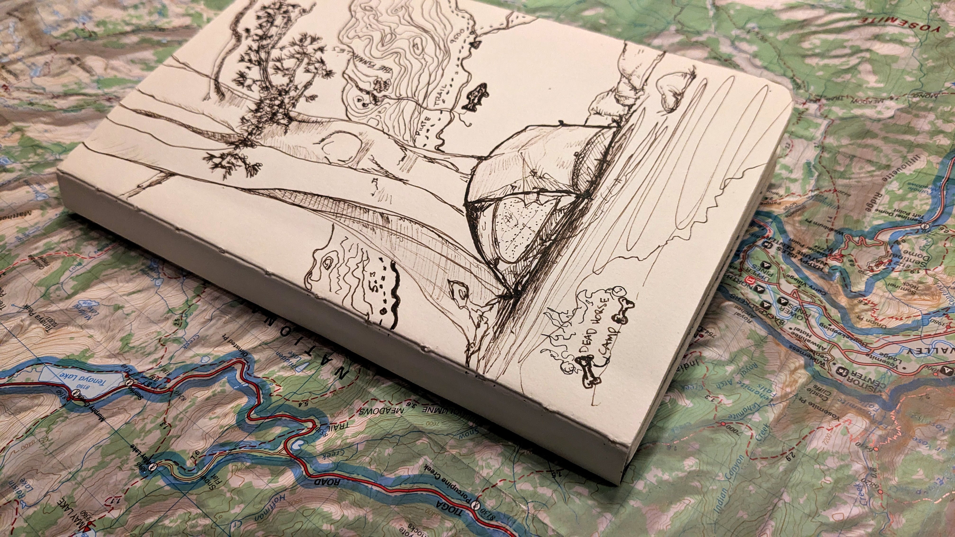 Wooden map with engraved details on a topographic map background