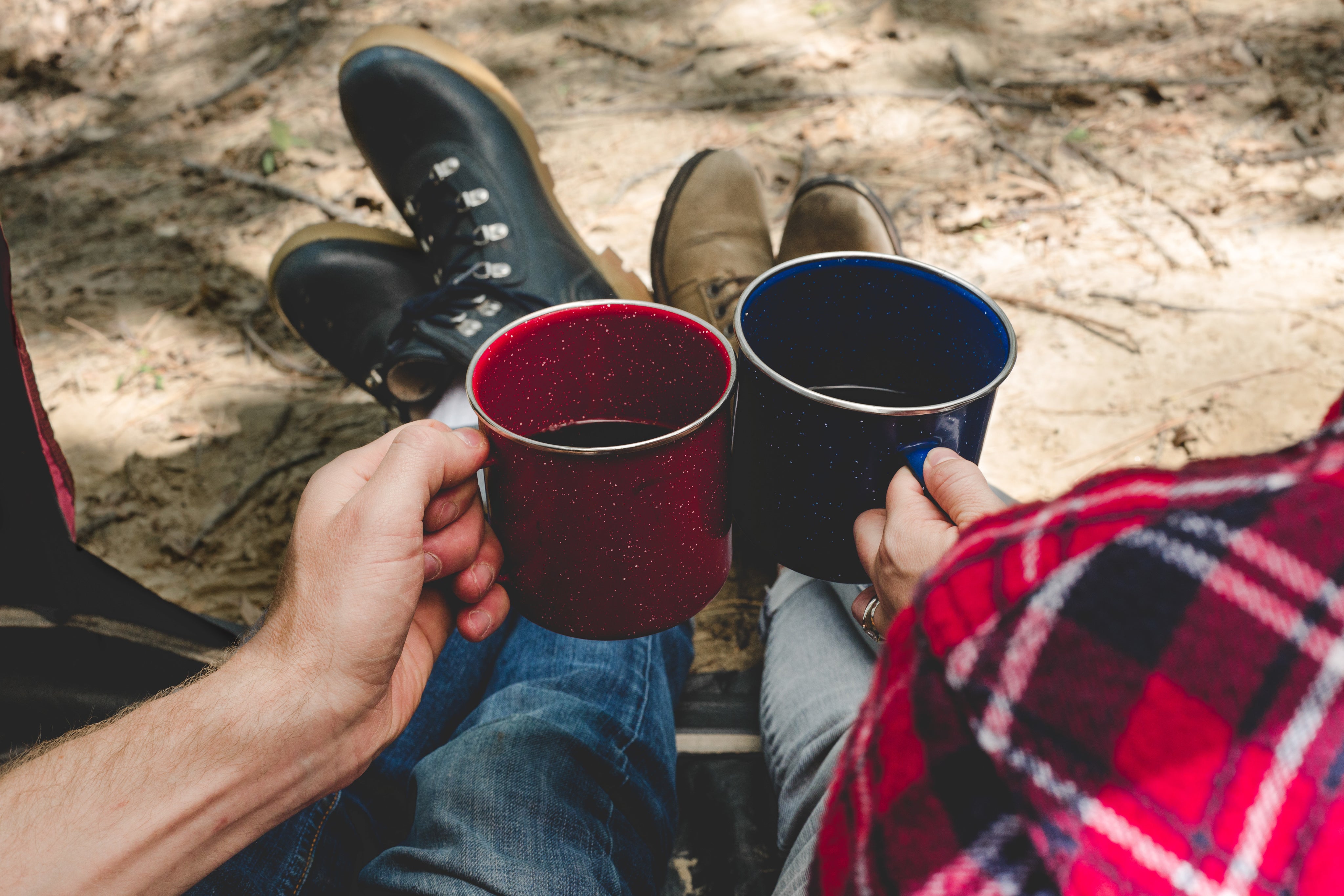 friends drinking coffee in a tent