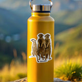 Yellow water bottle with meerkat design on a rock with a mountainous background