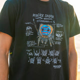 Person wearing a black t-shirt with a graphic design of a peacock spider and text.