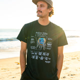 Man wearing a black t-shirt with a peacock spider on a beach