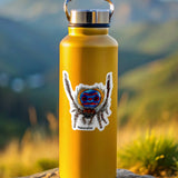 Yellow water bottle with a peacock spider sticker on a rock with a mountainous background