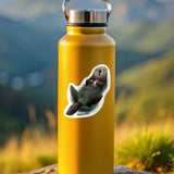 Yellow water bottle with a sticker of a sea otter